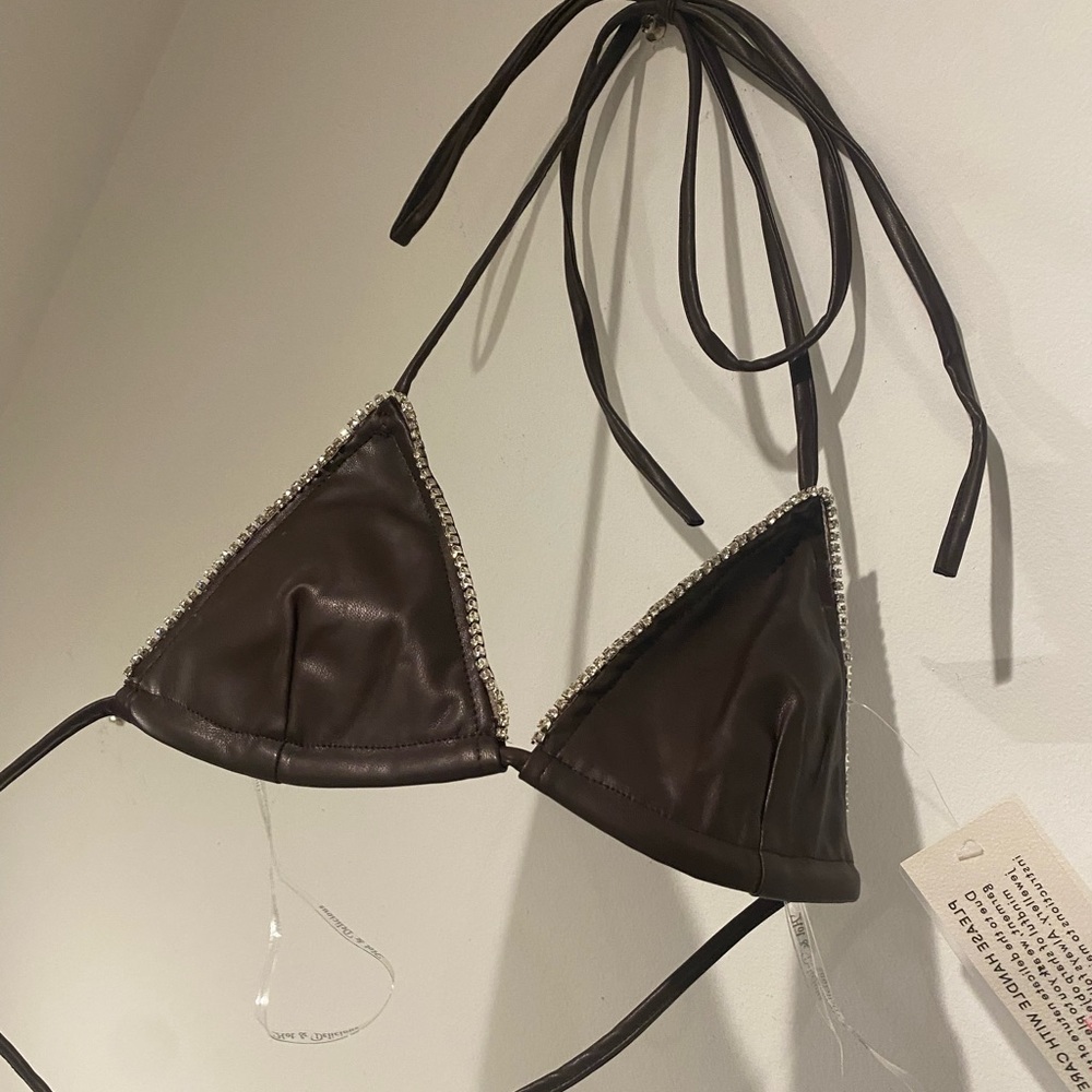 Faux brown leather top lined with rhinestones.